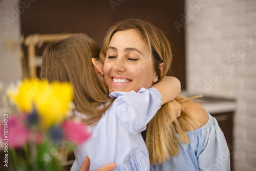 tender sincere hugs of mother and daughter. happy mother's day or birthday