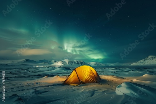 Glowing yellow tent under a starry sky with northern lights in a snowy landscape