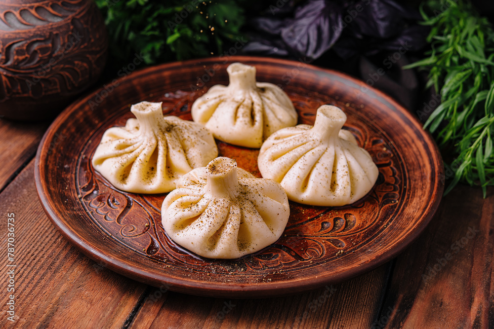 Georgian khinkali on traditional plate Georgian khinkali on traditional plate