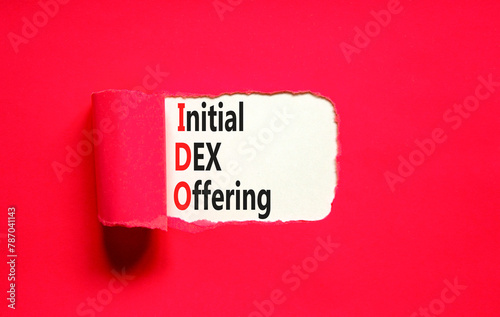 IDO initial DEX offering symbol. Concept words IDO initial DEX offering on beautiful white paper. Beautiful red paper background. Business IDO initial DEX offering concept. Copy space. photo