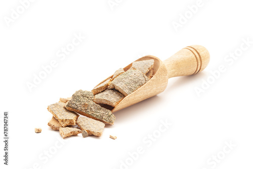 Front view of a wooden scoop filled with Organic Vauna Barks (Crataeva nurvala). Isolated on a white background. photo