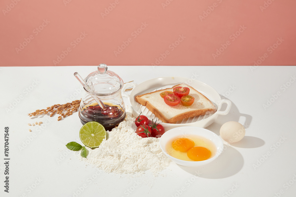 Layout with some essential ingredients for preparing simple breakfast in morning, rich in protein, calcium and vitamins. Empty space for advertising on pink background Layout with some essential ingredients for preparing simple breakfast in morning, rich in protein, calcium and vitamins. Empty space for advertising on pink background