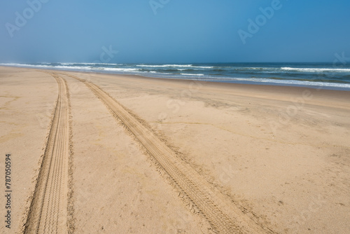 Car tire tracks in the sand of Skeleton Coast, Namibia
