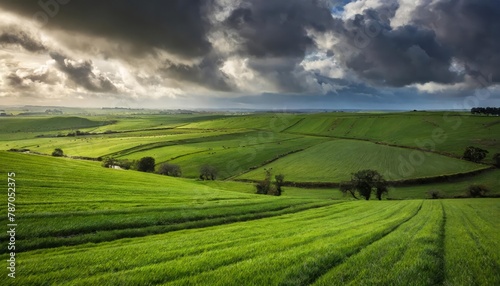 Dramatic sky over lush green rolling hills