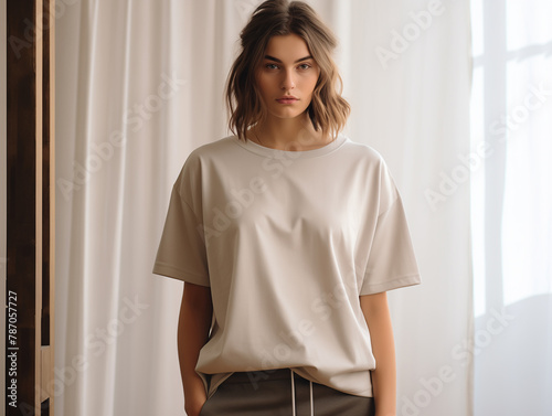 Young woman model dressed in beige oversized tshirt. Blank tee front view mockup. Girl, mom short sleeve t-shirt design template  (ID: 787057727)
