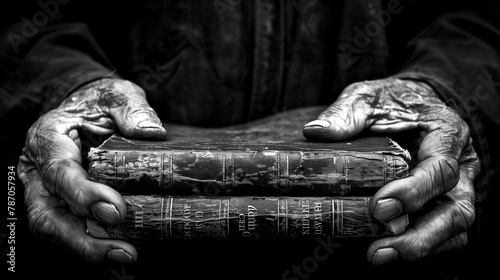 Person holding stack of vintage books in monochrome photography © Валерія Ігнатенко