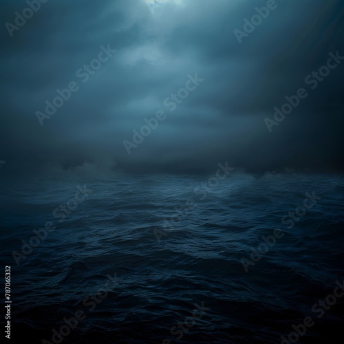 Moonlight shines on the water through the clouds at midnight