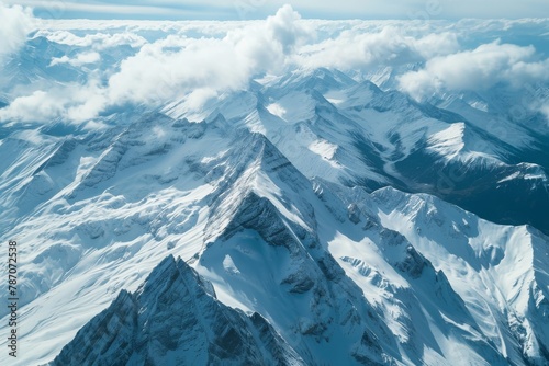 This photo captures a scenic view of the snow-covered summit of a mountain, Aerial view of snow-covered mountain range, AI Generated