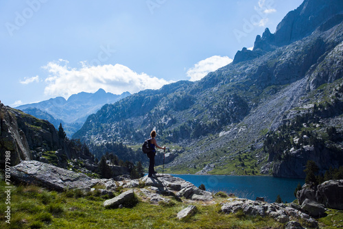 Young hiker woman in Vall de Boi, Aiguestortes and Sant Maurici National Park, Spain photo