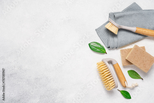 Cleaning supplies on a light background with copy space. Brushes and rags, gentle eco-cleaning