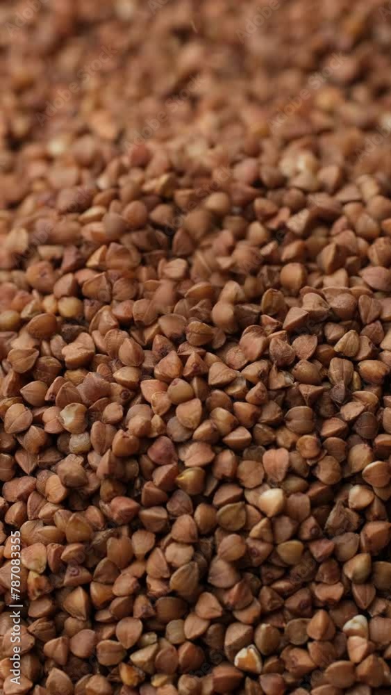 Heap of buckwheat grains in macro, rotation Heap of buckwheat grains in macro, rotation