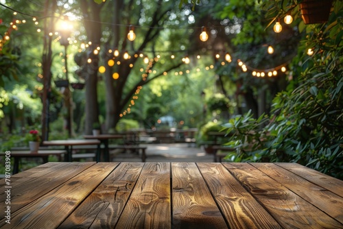 A serene evening in a park with a picnic table lit by strings of lights offering a tranquil and inviting outdoor space