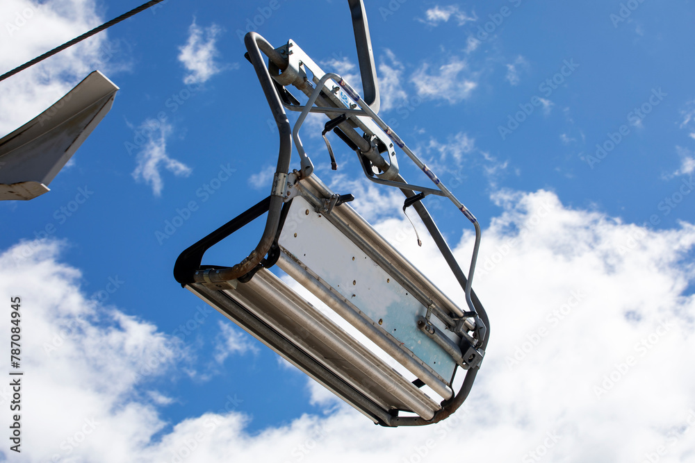 ski lifts against the background of a blue sky with clouds. Ski resort Active recreation ski lifts against the background of a blue sky with clouds. Ski resort Active recreation