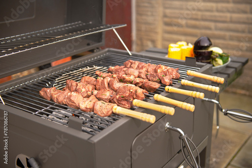 cook marinated pork neck meat on the grill, barbecue
