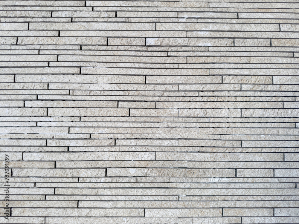 Natural decorative stone wall gray tones for use as background. Natural decorative stone wall gray tones for use as background.