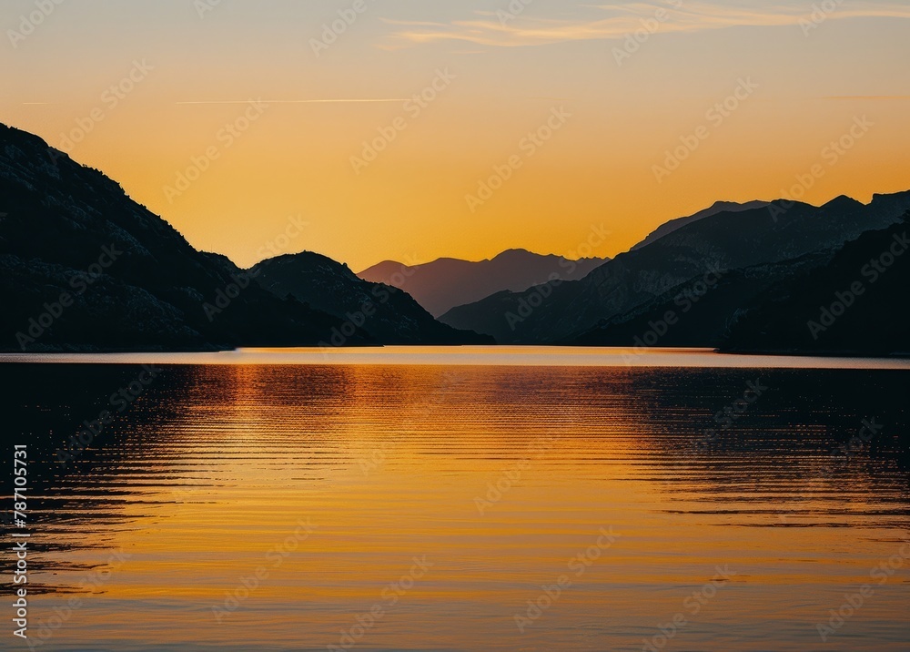 Sun Setting Over Mountain Lake