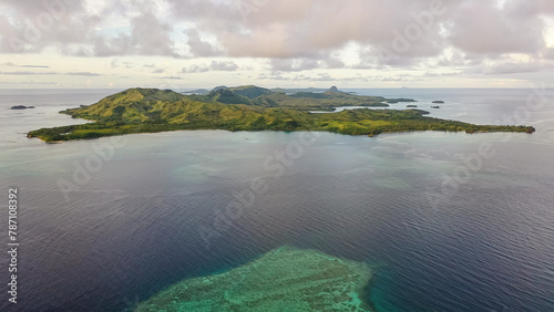 Drone view of the Fiji Islands. Ocean waters. Clouds over the islands. Vacation and travel concept. photo