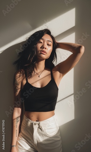 Woman in Black Top and White Shorts