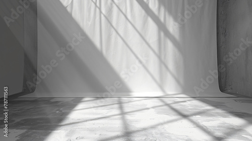 Spotlit grey floor in white and gray studio backdrop
