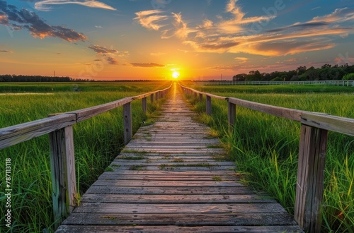 Wooden Walkway Leading to Marsh at Sunset