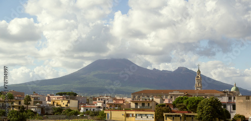 View of part of the city of Pompei, including Pontifical Shrine of the Blessed Virgin of the Rosary of Pompei and Pontificio Istituto Bartolo Longo, with the Mount Vesuvius in the background photo