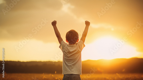 Triumphant Child with arms raised. victory and success
