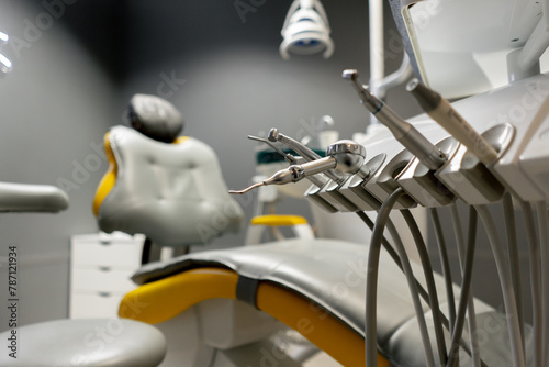 a dental office white sterile ready for robots yellow chair for the patient and white equipment