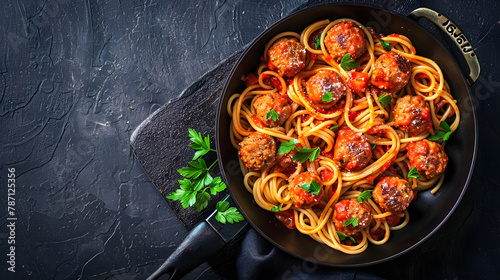 Spaghetti pasta with meatballs in tomato sauce with parsley in frying pan dark table background top view Banner copy space : Generative AI