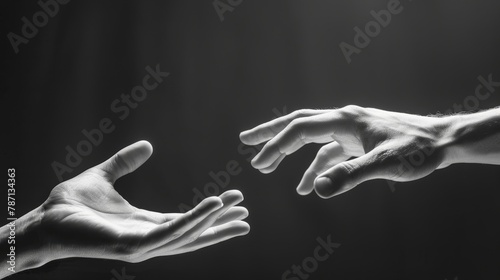 The hands of two people are forming a gesture of trust and openness. Black and white image.