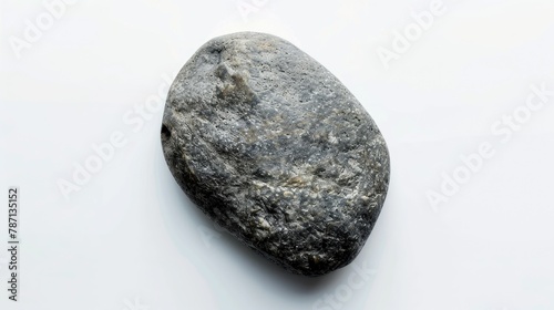 Single grey stone isolated on a white background viewed from above