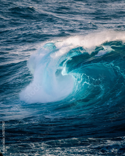 Crashing wave with blue light. Sun light ocean