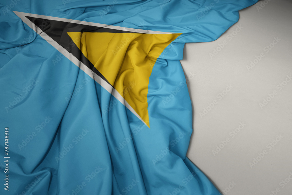 waving national flag of saint lucia on a gray background.