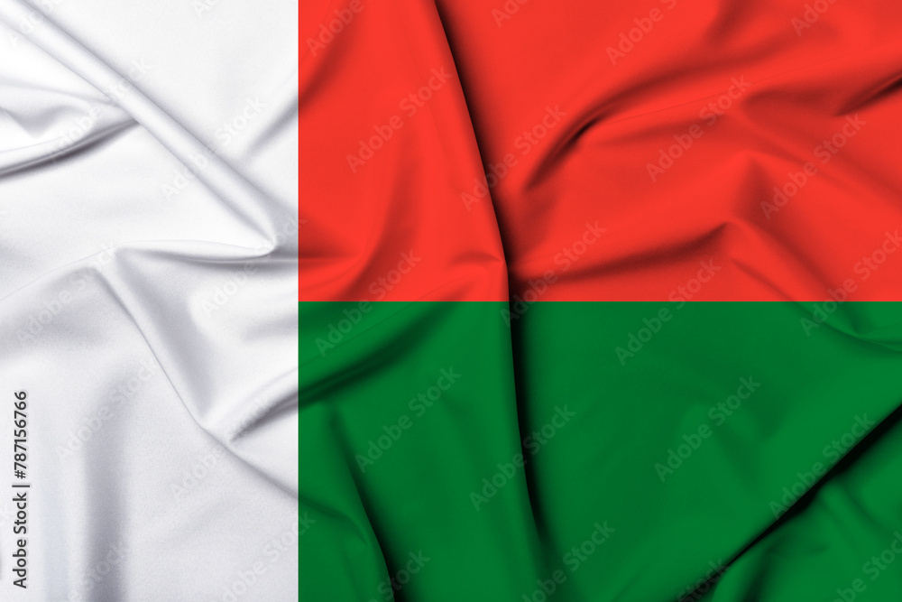 Beautifully waving and striped Madagascar flag, flag background texture with vibrant colors and fabric background