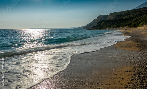 A beach in the glow of the setting sun on the Greek island of Kefalonia.