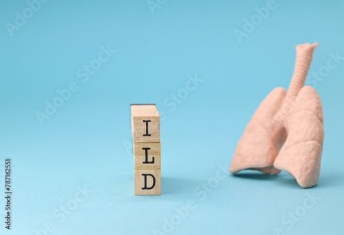 Abbreviation ILD (Interstitial Lung Disease) on blue background photo