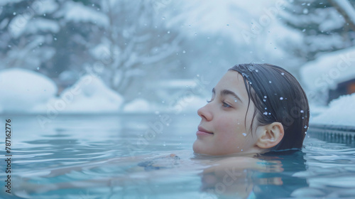 Young woman swimming in hot spring in winter © Ashley