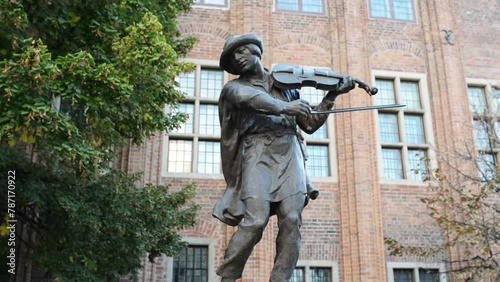 Violinist Monument to Town Hall Square in Torun photo