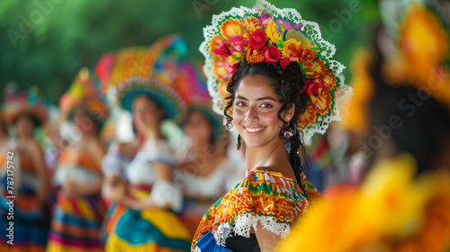 Woman in vibrant traditional Mexican attire smiling.