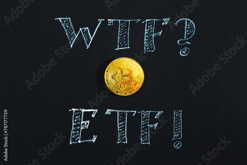 Bitcoin and ETF inscription in chalk close-up on a black background.
