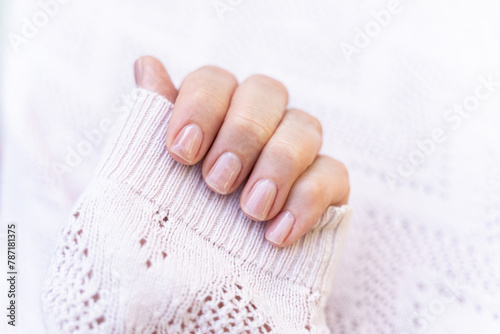 Obraz na płótnie Maintained female nails. Beautiful and natural manicure. Gel polish. Cleaned, shaped and varnished nails. Nail care. w salonie