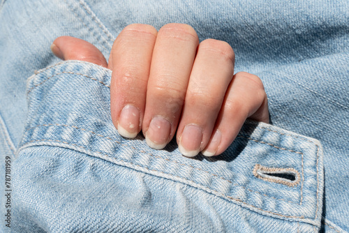 Obraz na płótnie Women's nails before they are shaped and varnished. Nail care. Natural color manicure. Nail maintenance. Gel polish. w salonie
