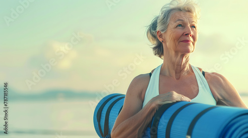 Middle age woman holding a sports mat and preparing to practice yoga outdoors on sea beach Happy mature overweight woman exercising on seashore copy space Meditation yoga and relaxatio : Generative AI photo