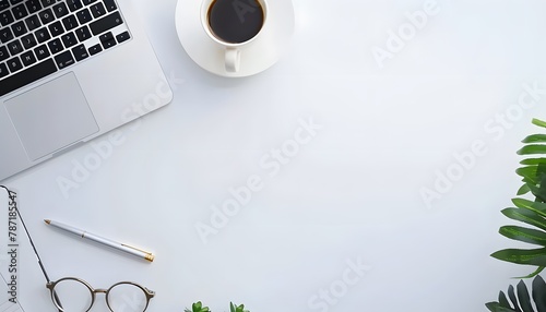 Top view of modern workplace with laptop, coffee cup and office supplies on white background
