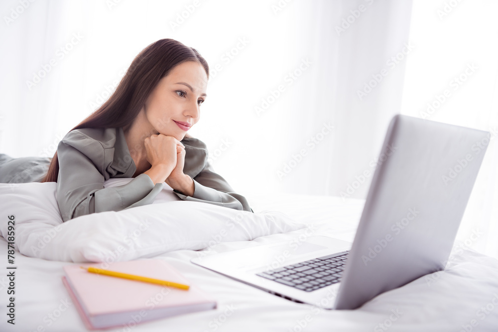 Photo of cute charming lady wear grey pajama enjoy weekend having remote courses modern device indoors house bedroom Photo of cute charming lady wear grey pajama enjoy weekend having remote courses modern device indoors house bedroom
