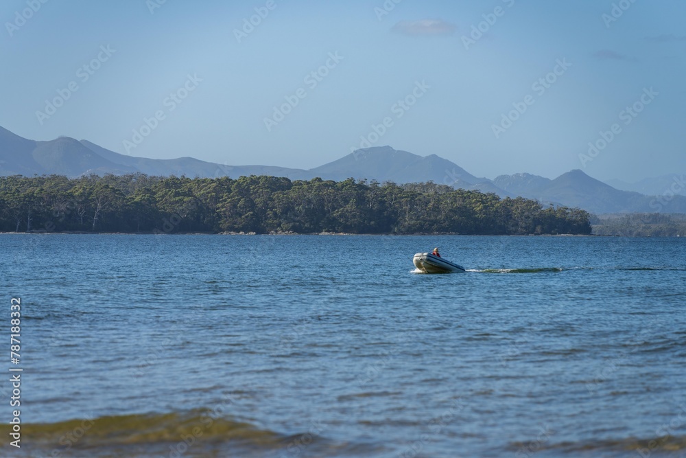 tinny dinghy boat on a river in a national park in the australian bush, On the beach in summer