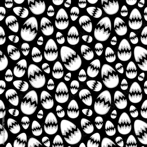 Cracked eggshells in different sizes arranged randomly on a black background. Simple monochrome seamless pattern for printing on different materials or use in graphic design projects.