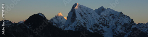 Sun lit mountain peaks of Ama Dablam and Cholatse at sunset, Nepal.