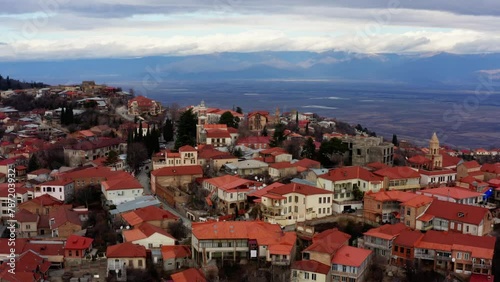 A sweeping aerial vista unveils Sighnaghi, nestled in the heart of Kakheti, Georgia, captured meticulously by a drone, revealing the town's timeless charm and scenic beauty photo