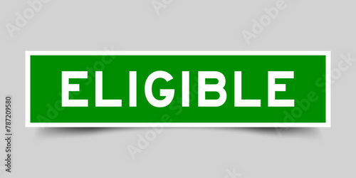 Green color square label sticker with word eligible that inserted in gray background