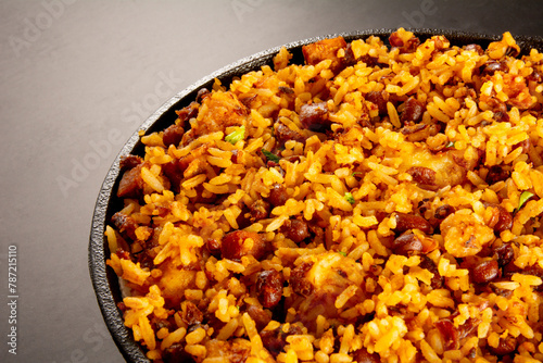 Baião de Dois traditional Brazilian food with rice, beans, sausage and rennet cheese close up photo